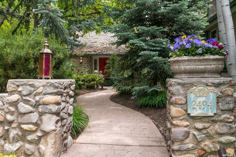 Classic Holladay home with a sprawling layout amidst a spectacular wooded garden setting. This glorious estate is tucked away in a gated enclave known as the premier spot of the Cottonwoods. Every room has a beautiful ambiance. Grand windows in the o...