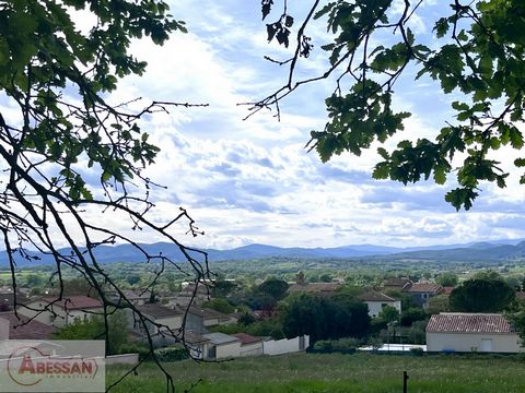 Gard (30), for sale exclusively, 5 minutes from Barjac, in the village of St-Jean-de-Maruejols-et-Avejan, a buildable and divisible flat plot of nearly 3000m², exceptional setting with a clear view and distant on the hills of the Cevennes, not overlo...