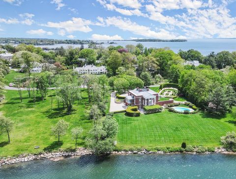 Regal waterfront estate in coveted Mead Point, one of Greenwich, Connecticut's few gated communities. Prominently sited on 2 glorious acres with Renaissance parterre gardens, luxurious pool and expansive open lawns stretching to over 225 feet of shor...