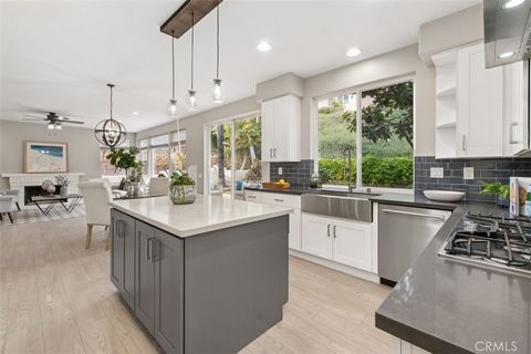 Contemporary elegance meets modern farmhouse chic. You’ll love this Portola Hills showcase, situated on a 12,750sf lot! Gorgeous curb appeal draws you in, with Queen palms, manicured landscaping, and a gated courtyard leading to the double-door entra...
