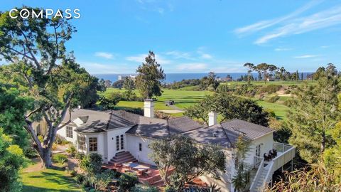 With stunning frontage and sweeping views of La Jolla Country Club and beautiful ocean views, this nearly one-acre property is one of the largest lots in West Muirlands. The single-level home with expansive front, side and back yards and multiple gar...