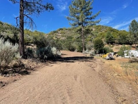 Great buildable 5 acre lot already graded with a road and building pad, secluded for privacy. Loads of room to build your dream home, separate flat area suitable for horse facilities. Many possibilities on this beautiful view lot with lots of towerin...