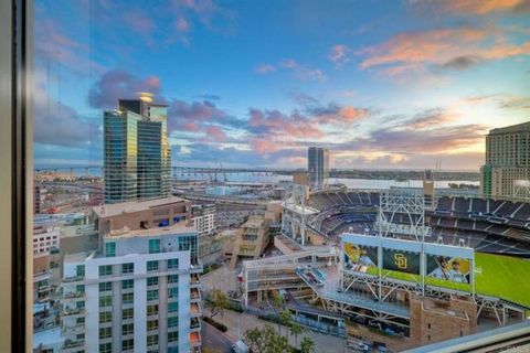 This remarkable 20th-floor residence offers vibrant ambiance and captivating southwest panorama views of the ocean, bay, Coronado Bridge/Island, the coveted Petco Park, expansive city lights and towering high-rises. Perched directly above Petco Park,...