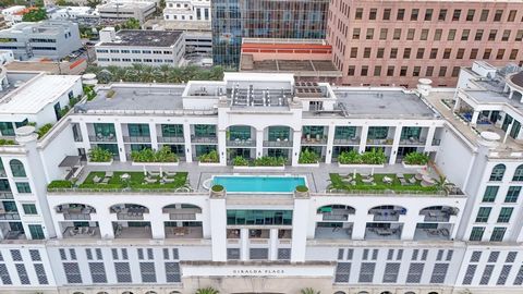 Discover luxurious living in the heart of Coral Gables with these two unique condos seamlessly combined into one phenomenal space (4,986 SF). This property is a true sanctuary, boasting 11-ft. ceilings, four balconies, a private elevator foyer, two k...