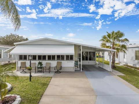 This immaculate 2-bed, 2-bath home in Barefoot Bay boasts multiple upgrades, a newer AC, durable metal roof and vapor barrier, offering peace of mind and efficiency for years to come. Enhanced tie-downs, including additional carport tie-downs, guaran...
