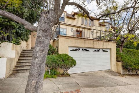 Welcome to a piece of Old Hollywood nestled in the serene Los Feliz Hills. This meticulously preserved 1936 classic, untouched by the market since 1968, awaits your discovery. Prepare to be enchanted by the timeless elegance and grandeur of this resi...