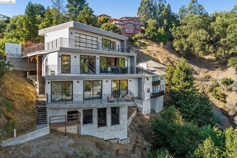 This spectacular home could be your dream home. Perched in an upscale established neighborhood, Hiller Highland, each of the 3 floors of the home turns 15 degrees and captures tranquil canyon and bay views from different angles. The flexible open con...