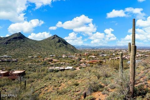 Welcome to the last available hillside lot in the exclusive gated enclave of Canyon Heights. With nearly 10 acres of panoramic sunset and city light views, this elevated lot offers a rare opportunity to build your dream home. The entrance to the parc...
