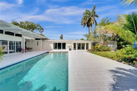 Welcome to this unparalleled masterpiece crafted by none other than famous Miami Architect Barry Sugerman. Step into Mid Century Modern elegance, embracing architectural brilliance. Meticulously renovated, this pool home on a double lot, offers opule...