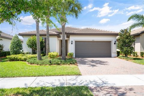 Living at its best! Home has impact windows, plantation shutters, kitchen package upgrade, large extended master closet, laundry room upgrade, extra garage storage. Zero corner sliding glass impact doors let the outside in! Enjoy a panoramic water vi...