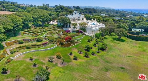 Four Seasons meets Malibu: Stately and majestic, this legacy estate sits on approximately 5 acres of manicured grounds, with expansive ocean & coastline views. Wide open patio spaces surrounding the infinity pool & spa, allows for large parties. The ...