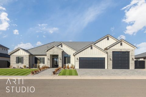 Stunning lightly lived in New Trend Construction home ideally located in desirable Sycamore Village neighborhood, 7 minutes from Sand Hollow State Park! Attractive big yard with a basketball court, fire pit & large turf areas. Open floor plan with 10...