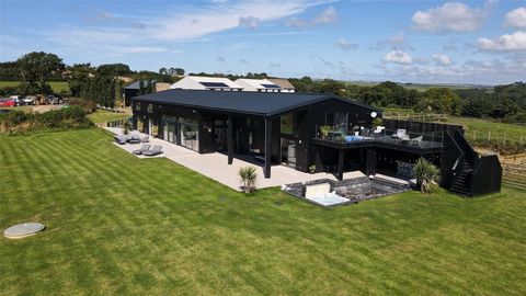 Welcome to Wild Winds, an extraordinary 6/7 bedroom, 5-ensuite contemporary barn conversion offering over 6,800 square feet of exquisite living space, expertly designed for modern luxury. Perfectly located in the heart of the Devon countryside, this ...