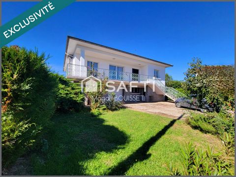 Maison traditionnelle T5 de 160m², trois chambres, dressing, véranda, terrasse avec vue, garage et atelier, jardin idéale pour une grande famille.