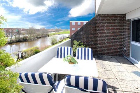 Small holiday apartment with balcony, a short walk from the beach and with a beautiful view of the Dornumersieler Tief. The North Sea resort of Dornumersiel is located directly on the coast and is ideal for families with small children. From the beac...