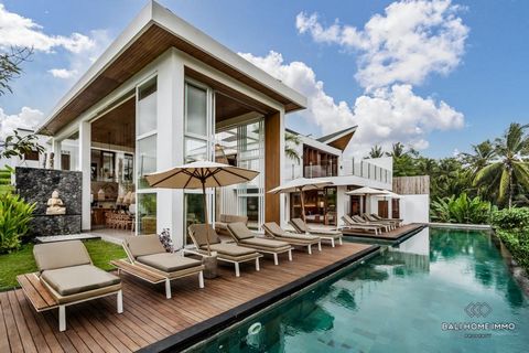 -   Leasehold 26 years for 850,000 Euro   Nestled in the heart of Ubud's residential area, this modern two-story residence presents an exceptional opportunity for those seeking a spacious and elegantly designed home. With a substantial land size of 1...