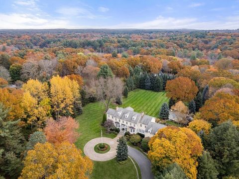 Set on over 3.3 acres of manicured & rolling lawns, this stately 5 bedroom home has the perfect floor plan & is filled w/ sunshine and warmth. Enter this private retreat thru stone pillars & a welcoming circular drive. Kitchen w/ large island & walk-...