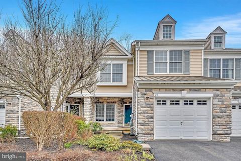 Step into the refined charm of this updated Bainbridge model townhome nestled in the prestigious Estates at Princeton Junction. This residence boasts a coveted position, backing onto a serene conservation area that ensures both privacy and picturesqu...
