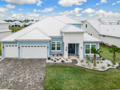 Welcome to Paradise!! Your custom beach retreat home is nestled in the gated enclave of Seaside Estates in Beachwalk, home of the 14 acre crystal lagoon with swim up bar so you feel like you are on vacation year round!! So well appointed, this home h...