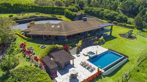 A magnificent 360 degree view on one level, this gated Kula estate offers an Upcountry lifestyle, a great location and privacy, on nearly 8 acres of pasture land. Your main living room takes place in the spacious great room with 11' ceilings, custom ...