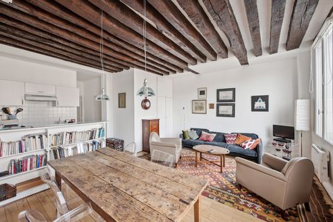 Welcome to this charming apartment nestled in the heart of Paris on Quai des Grands Augustins. This bright and inviting space offers a quintessential Parisian living experience, boasting stunning views of the Seine River and the iconic Notre Dame Cat...