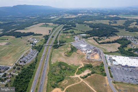 9.3 acres of prime commercial/industrial use land! Located right on Interstate 81 in Woodstock, Virginia. Exposure to over 46,000 vehicles a day. Property is located behind the Walmart Shopping Complex and beside Criswell Ford and Criswell Chrysler, ...