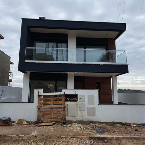 Contemporary and Timeless Architectural Residence Move to where your dream already resides! Detached 3+1 bedroom residence (in stage of completion) nestled in a residential area with various houses and buildings, showcasing the integration of archite...