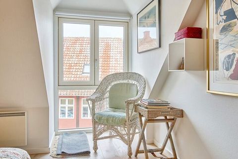 First floor, perfectly situated apartment with French balcony in the heart of Svaneke. Modern, light furniture and wood-burning stove. Patio with garden furniture and Weber grill. Free access to internet - please bring your own pc. Walking distance t...