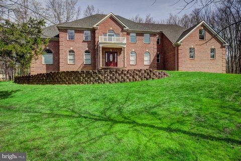 Discover the potential of this charming Colonial, where you can unleash your creativity and add your personal touch. Welcome to this sunlit and spacious, elegant 5 Bedroom, 5.5 Bath custom built Colonial set discreetly back on almost 2 acres in the e...