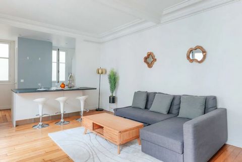 The apartment benefits from excellent natural light due to its exposure, creating a warm and welcoming atmosphere. It is fully equipped, and its modern decor blends perfectly with the original features such as the wooden floors, fireplace, and moldin...