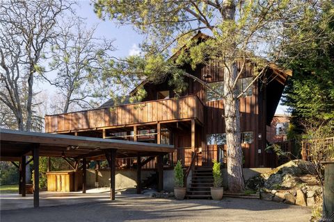 Welcome to a one-of-a-kind masterpiece capturing the essence of late '70s West Coast architecture. Perched among the trees on a serene 0.305-acre lot, this home offers ultimate privacy with a gated entry and a picturesque long driveway with the backy...