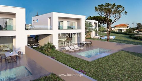 Fantastic 4-bedroom luxury villa in the new Oliveiras Residence private condominium in Quarteira , in the Algarve 's prestigious Golden Triangle . This spacious villa is spread over 2 spacious and bright floors . The ground floor is divided into two ...