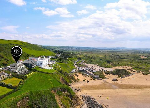 This duplex apartment for sale is situated in a prime location at Saunton Sands in North Devon, offering breath-taking ocean views. The property features two bedrooms on the lower ground floor one of which is ensuite, providing both comfort and conve...