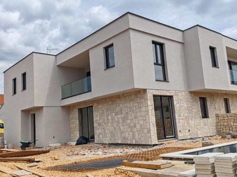 Exclusive semi-detached house with swimming pool on Pag peninsula, 300 meters from the sea only! Total area is 230 sq.m. Land plot is 330 sq.m. This exclusive villa, nearing completion, is designed as a semi-detached dwelling spanning two floors, eac...