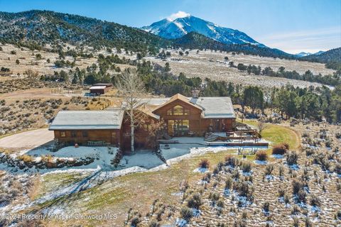 Well-built four-bedroom ranch style home with total end of the road privacy on 15.8 acres featuring a spectacular view of Mt. Sopris and Red Hill and a sunny Southern exposure. Beautiful hickory hardwood floors, cherry cabinetry, marble tops and floo...