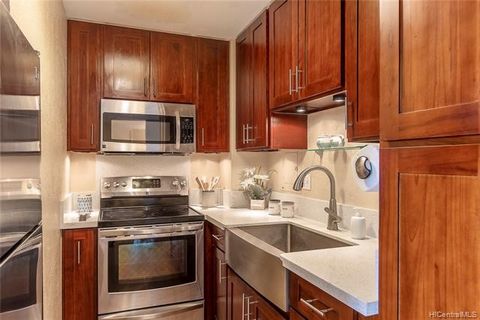 Welcome to Waialae Place where you will find this lovely 2 bedr, 1 bath renovated apartment w/ 1 covered prking stall & a storage locker. The kitchen boasts stainless steel appliances, custom cabinets, & quartz countertops that pair nicely with the d...