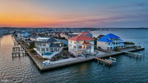 The opportunity to own the premier property in Ocean Pines comes around only once in a blue moon. Situated on a point lot on Leigh Drive with the most unobstructed views in the Tern's Landing neighborhood. The 3 level Mediterranean masterpiece has be...