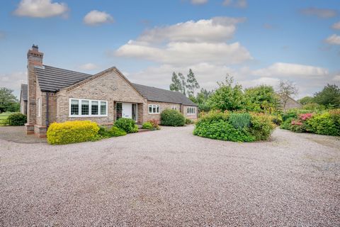 A modern, four-bedroom, three bathroom detached bungalow, with good-sized matures gardens and land behind with spectacular river frontage. This immaculately presented family home benefits from the recently refurbished kitchen-breakfast, bright and we...