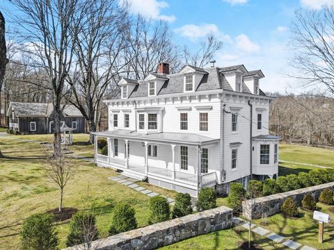 Welcome to the Brush-Lockwood House, an anchor of significant antique homes in the Stanwich Historic District and a notable Greenwich Landmark. Poised on 5.2 acres, this impressive eight-bedroom residence spans four levels with well-scaled rooms idea...