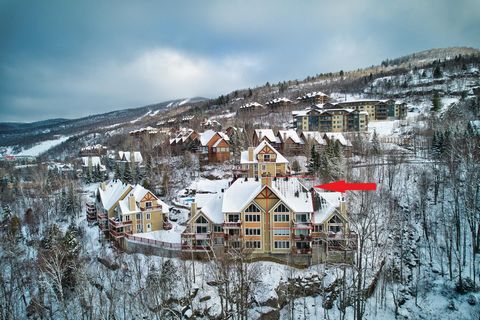 TREMBLANT SKI-IN/SKI-OUT seize this rare opportunity: 3 bedroom 3 full bathroom condo on the south side of Tremblant International resort, cathedral ceilings in the living room and dining room/kitchen, majestic stone fireplace in the living room, und...