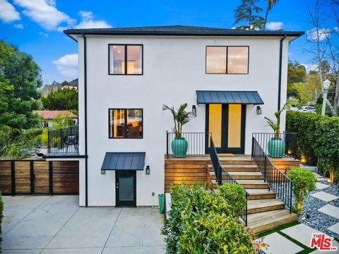 Nestled along a secluded, private street near Lake Hollywood, this magnificent recently built residence is a haven for those who love to entertain. The contemporary yet tranquil home boasts nearly 5,000 square feet on an 11,000 square foot lot. Exudi...