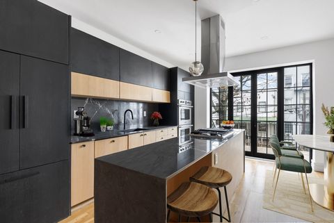 Exquisite Renovated Townhouse in Bedford-Stuyvesant: Luxury Living, Prime Investment OpportunityNestled in the vibrant Bedford-Stuyvesant neighborhood, this meticulously renovated three-family townhouse presents opulent interiors, secluded outdoor re...