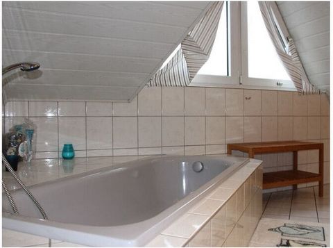 Charming in Germany. You can expect 140m² pure vacation with 4 bedrooms, 2 bathrooms, 1 guest toilet and 1 kitchen. The holiday home has a garden with covered outdoor seats, a sun lounger and a decorative pond. There is also the possibility of grilli...