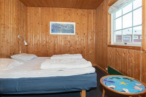 In the 1st row to the ocean, right behind the dunes, is this holiday cottage approx. 50 m from the North Sea. Open concept kitchen and living room with TV with i.a. international channels and wood-burning stove. Well-equipped kitchen with i.a. cerami...