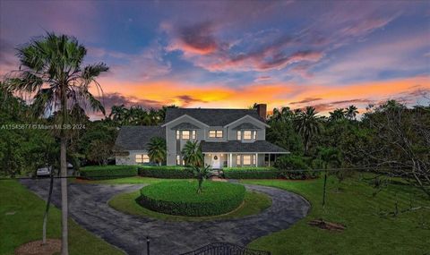 This graceful 2-story Southern Living Colonial-inspired home offers a private haven on a lush 2.5-acre estate in The Redland. The symmetrical facade is complemented by a wraparound porch and circular driveway. Inside, 3 bedrooms, including an owners ...