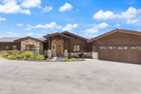 Beautiful mountain contemporary home nestled within the private gates of Tuhaye. Just off the signature 9th hole. 1.42 acres of natural surroundings positioned to capture views of Mt. Timponogas, Deer Valley, Uinta mountains, and multiple golf holes....