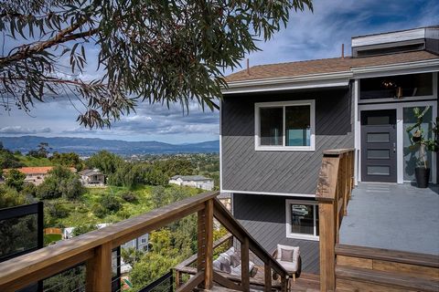 Sweeping panoramic views dominate at this sexy contemporary hillside home. Enjoy serene views of the Woodland Hills Country Club, treetops, and mountain vistas from one of many balconies and decks this home has to offer. Incredible opportunity to liv...