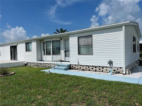 Welcome to Lemon Bay Isle Living Discover the essence of Florida living in this spacious and inviting 3-bedroom, 2-bathroom mobile home nestled in the coveted Lemon Bay Isle community of Englewood. With a size of 1792 square feet, this 1990 model dou...