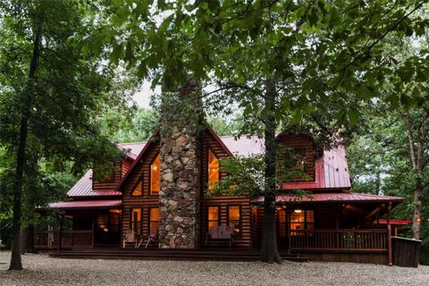 Chimney Rock Lodge, a spectacular traditional cabin nestled amidst the serene woods, offering the perfect blend of tranquility and convenience. This secluded retreat on 1.64 acres provides a peaceful escape while still being located close to amenitie...
