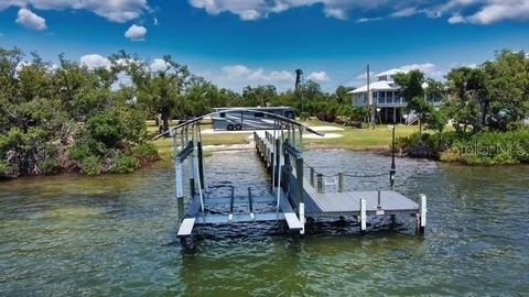 Experience the ultimate waterfront lifestyle with this exceptional .44-acre property on the Intracoastal Waterway, offering .87 acres of submerged land and endless potential. Boasting panoramic views of Placida Harbor and stunning sunsets, this is a ...